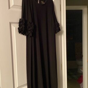 Taylor black dress with ruffle sleeves.